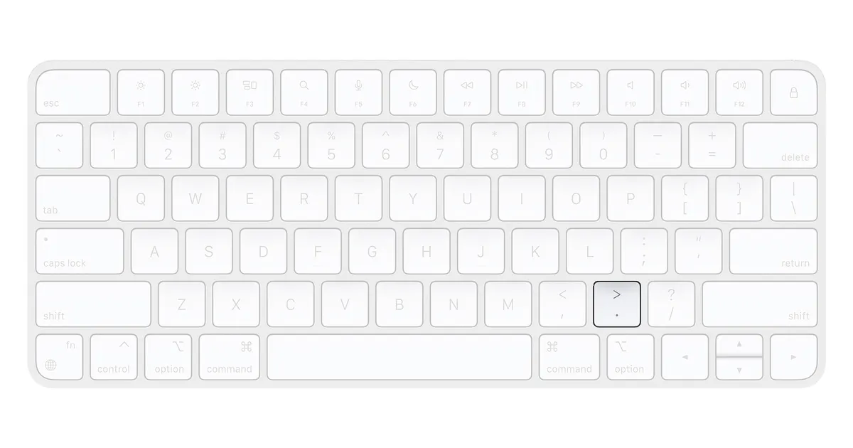 Mac keyboard, emphasizing the . key